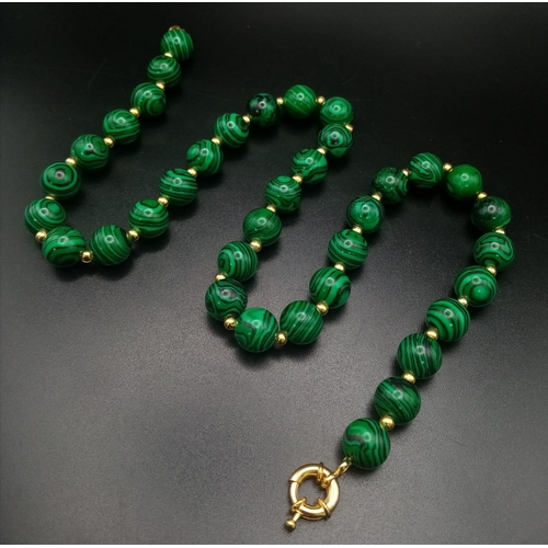 1507 - A Malachite Beaded Necklace with Gilded Spacers. 44cm