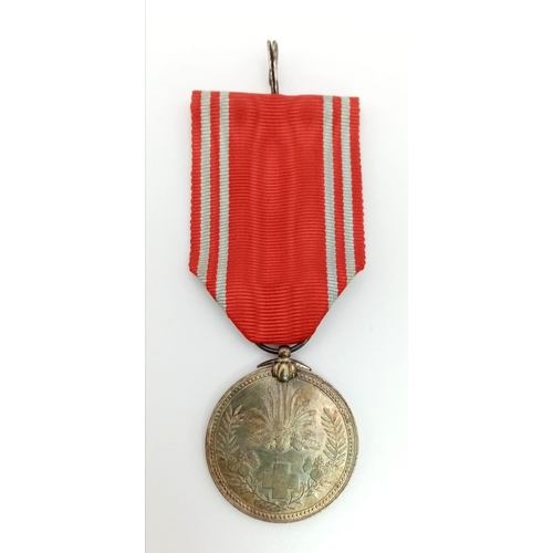 1128 - WORLD WAR II JAPANESE RED CROSS MEDAL WITH LAPEL BOW. CIRCE 1939/45