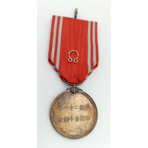 1128 - WORLD WAR II JAPANESE RED CROSS MEDAL WITH LAPEL BOW. CIRCE 1939/45