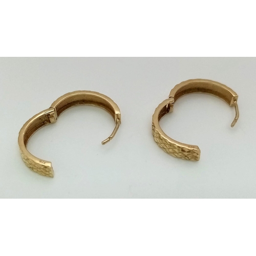 1223 - A Pair of 9K Yellow Gold Hoop Earrings. Geometric decoration. 2.25g total weight.