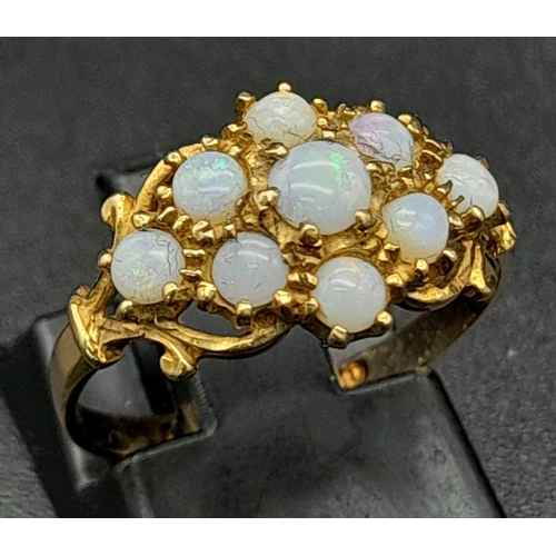 1342 - A Vintage 9K Yellow Gold and Opal Ring. Nine small quality opals. Size M. 1.76g total weight.