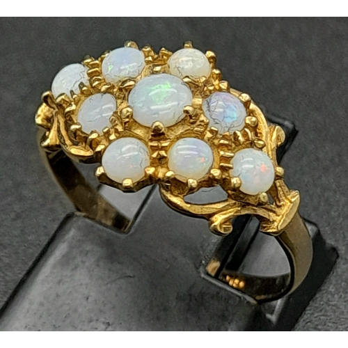 1342 - A Vintage 9K Yellow Gold and Opal Ring. Nine small quality opals. Size M. 1.76g total weight.