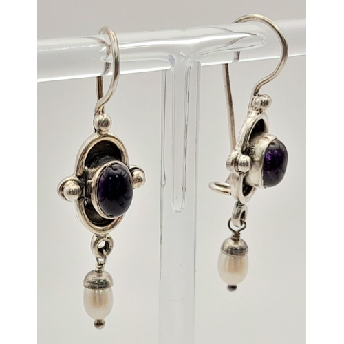 1380 - A Pair of Silver Purple Stone earrings.