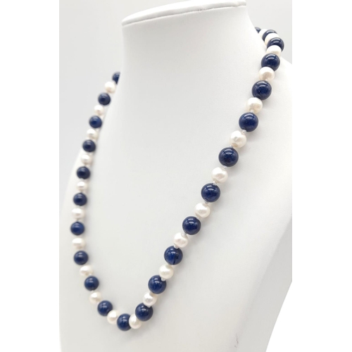 1387 - A Lapis Lazuli and Cultured Pearl Necklace. 8mm beads and pearls. 42cm