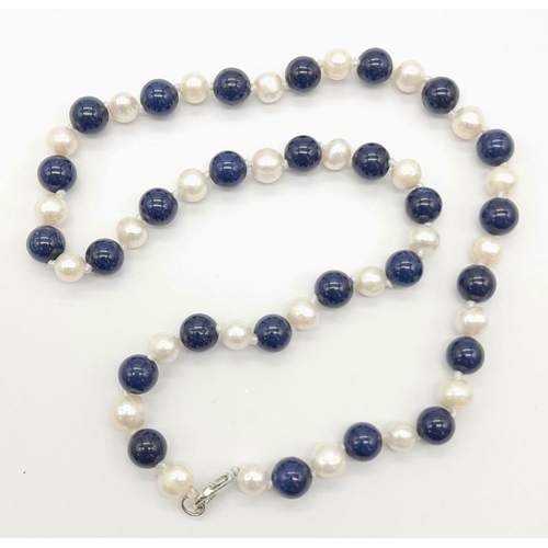 1387 - A Lapis Lazuli and Cultured Pearl Necklace. 8mm beads and pearls. 42cm