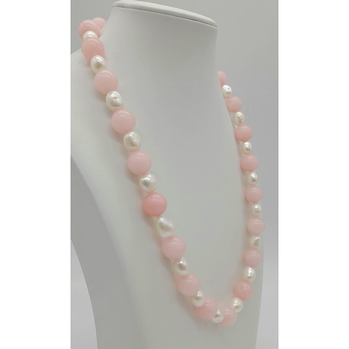 1495 - A Pink Jade and Cultured Baroque Pearl Necklace. 12mm beads and irregular pearls. 46cm