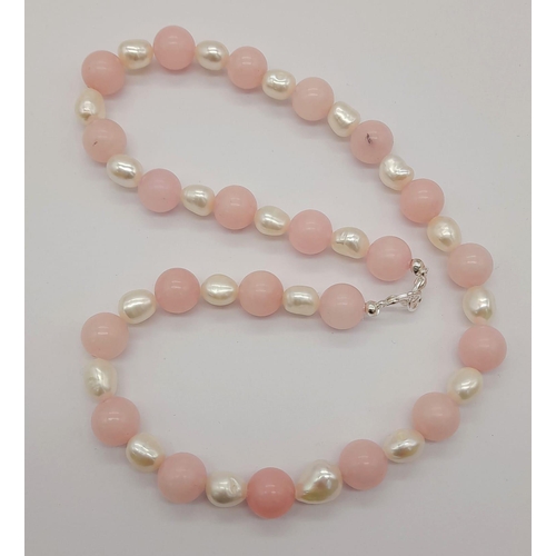 1495 - A Pink Jade and Cultured Baroque Pearl Necklace. 12mm beads and irregular pearls. 46cm