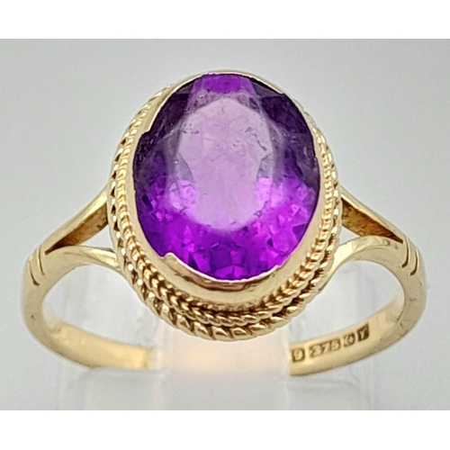 1769 - A Vintage 9K Yellow Gold Amethyst Ring. Clean, oval cut amethyst. Size N. 2.73g total weight.