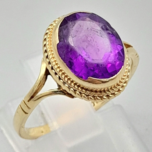 1769 - A Vintage 9K Yellow Gold Amethyst Ring. Clean, oval cut amethyst. Size N. 2.73g total weight.