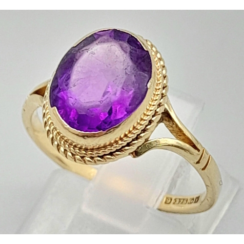 1769 - A Vintage 9K Yellow Gold Amethyst Ring. Clean, oval cut amethyst. Size N. 2.73g total weight.