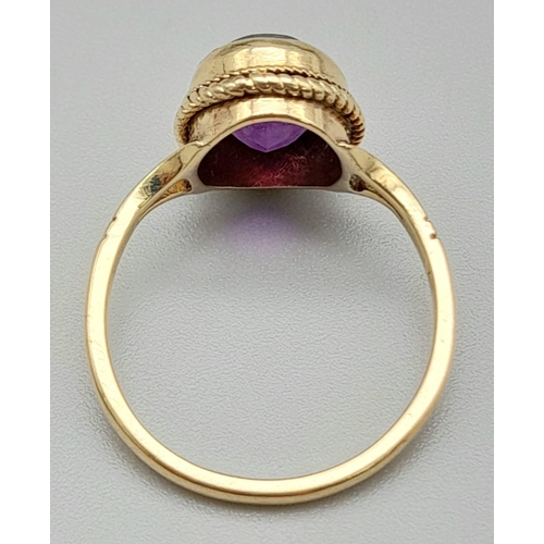 1769 - A Vintage 9K Yellow Gold Amethyst Ring. Clean, oval cut amethyst. Size N. 2.73g total weight.