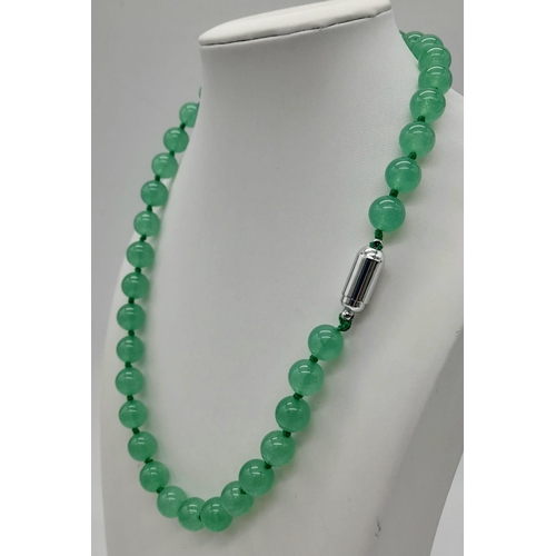 779 - A Pale Green Jade Bead Necklace with Magnetic Clasp. 10mm beads. 44cm necklace length.