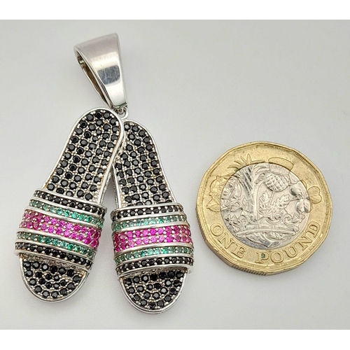 799 - A Silver, Emerald, Ruby and Sapphire Pair of Slippers Pendant.