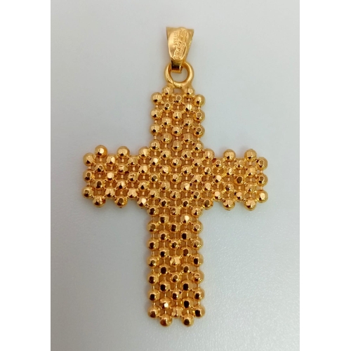 827 - An Italian 14K Yellow Gold Cross Pendant. 3 x 2cm. 1.8g