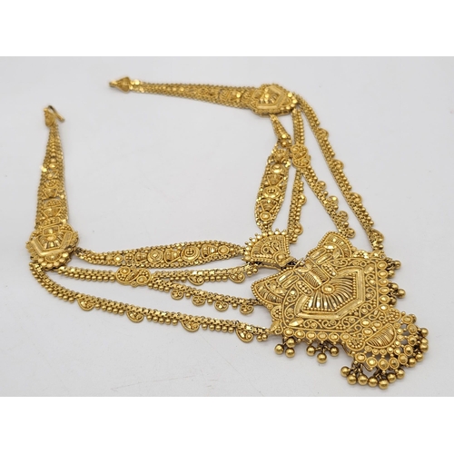 712 - Withdrawn
A yellow gold mixed lot consisting of: 
22 K Necklace and pair of earrings (butterfly miss... 