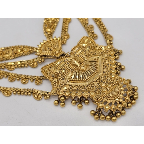 712 - Withdrawn
A yellow gold mixed lot consisting of: 
22 K Necklace and pair of earrings (butterfly miss... 