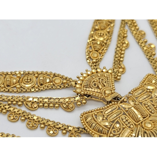 712 - Withdrawn
A yellow gold mixed lot consisting of: 
22 K Necklace and pair of earrings (butterfly miss... 