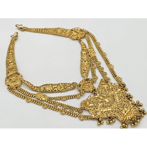 712 - Withdrawn
A yellow gold mixed lot consisting of: 
22 K Necklace and pair of earrings (butterfly miss... 