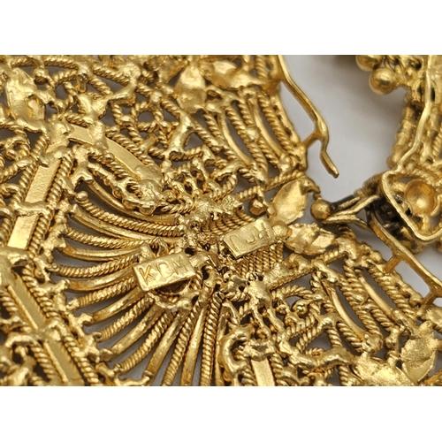 712 - Withdrawn
A yellow gold mixed lot consisting of: 
22 K Necklace and pair of earrings (butterfly miss... 