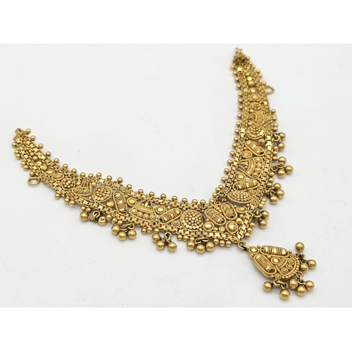 712 - Withdrawn
A yellow gold mixed lot consisting of: 
22 K Necklace and pair of earrings (butterfly miss... 