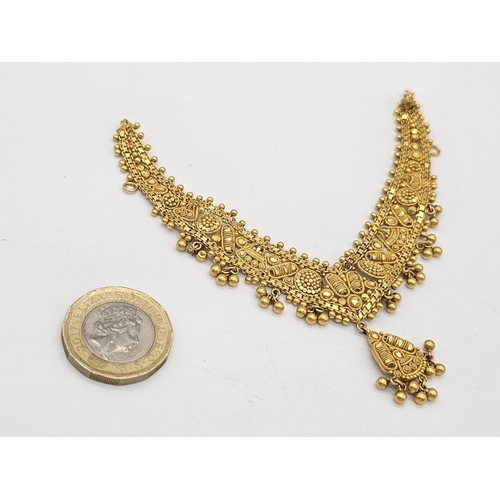 712 - Withdrawn
A yellow gold mixed lot consisting of: 
22 K Necklace and pair of earrings (butterfly miss... 