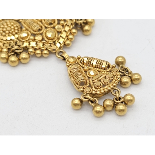 712 - Withdrawn
A yellow gold mixed lot consisting of: 
22 K Necklace and pair of earrings (butterfly miss... 