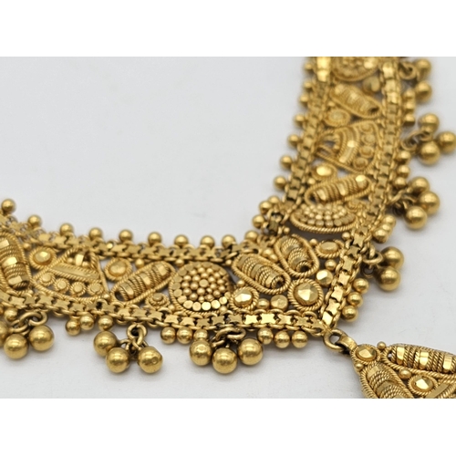 712 - Withdrawn
A yellow gold mixed lot consisting of: 
22 K Necklace and pair of earrings (butterfly miss... 