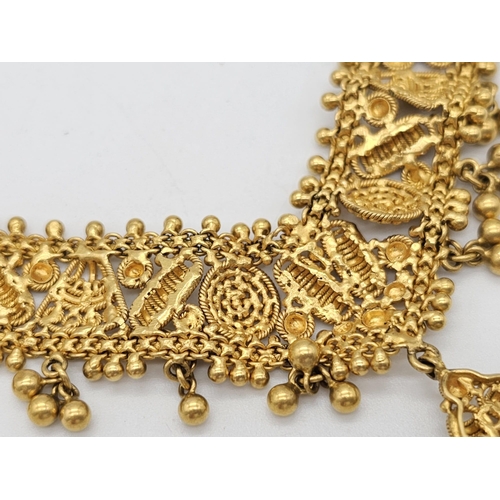 712 - Withdrawn
A yellow gold mixed lot consisting of: 
22 K Necklace and pair of earrings (butterfly miss... 