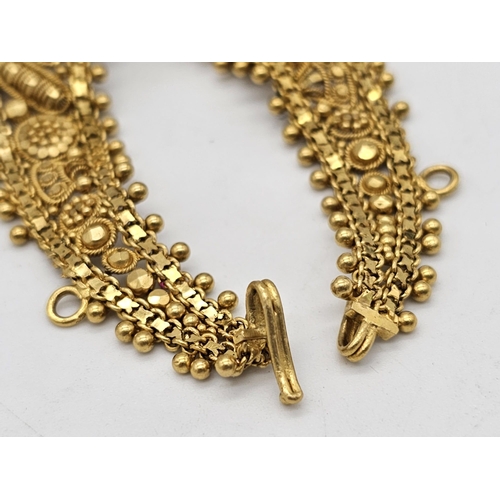 712 - Withdrawn
A yellow gold mixed lot consisting of: 
22 K Necklace and pair of earrings (butterfly miss... 