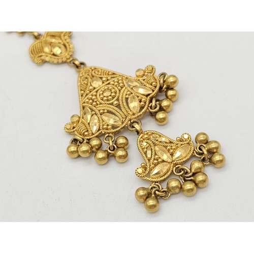 712 - Withdrawn
A yellow gold mixed lot consisting of: 
22 K Necklace and pair of earrings (butterfly miss... 