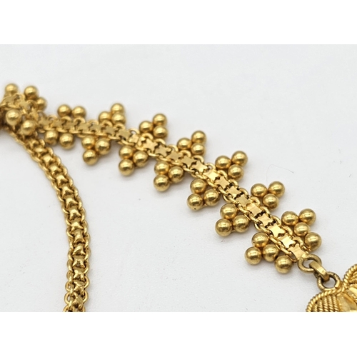 712 - Withdrawn
A yellow gold mixed lot consisting of: 
22 K Necklace and pair of earrings (butterfly miss... 