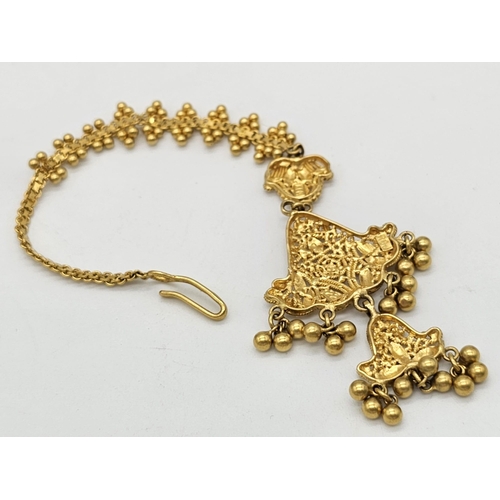 712 - Withdrawn
A yellow gold mixed lot consisting of: 
22 K Necklace and pair of earrings (butterfly miss... 