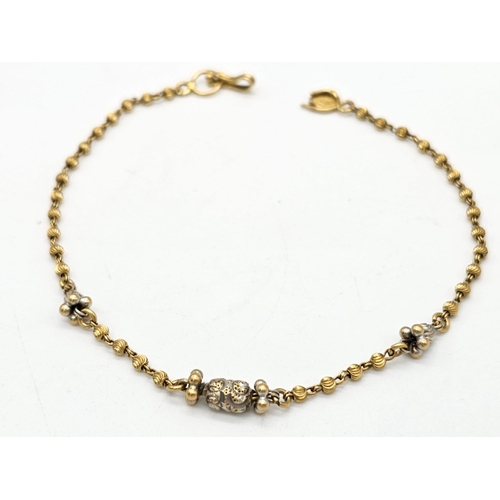 712 - Withdrawn
A yellow gold mixed lot consisting of: 
22 K Necklace and pair of earrings (butterfly miss... 