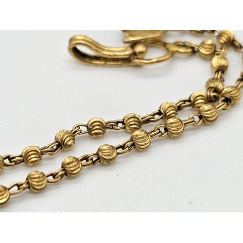 712 - Withdrawn
A yellow gold mixed lot consisting of: 
22 K Necklace and pair of earrings (butterfly miss... 