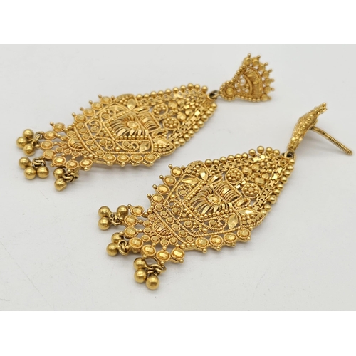 712 - Withdrawn
A yellow gold mixed lot consisting of: 
22 K Necklace and pair of earrings (butterfly miss... 