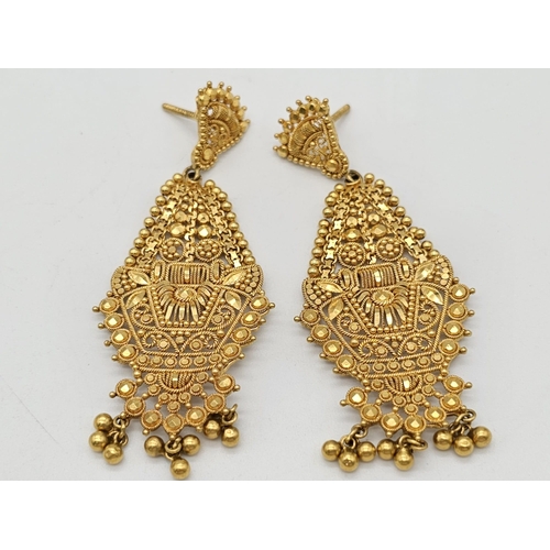 712 - Withdrawn
A yellow gold mixed lot consisting of: 
22 K Necklace and pair of earrings (butterfly miss... 