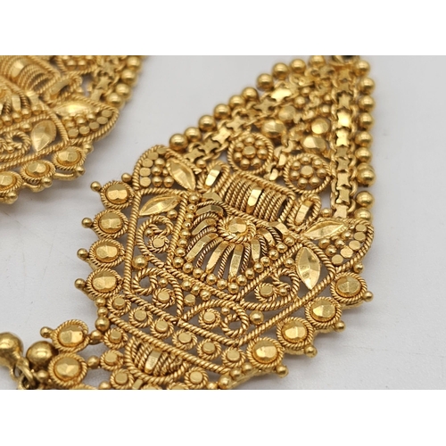 712 - Withdrawn
A yellow gold mixed lot consisting of: 
22 K Necklace and pair of earrings (butterfly miss... 