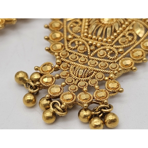 712 - Withdrawn
A yellow gold mixed lot consisting of: 
22 K Necklace and pair of earrings (butterfly miss... 