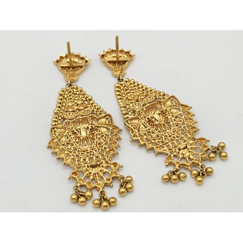 712 - Withdrawn
A yellow gold mixed lot consisting of: 
22 K Necklace and pair of earrings (butterfly miss... 