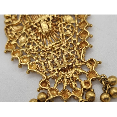 712 - Withdrawn
A yellow gold mixed lot consisting of: 
22 K Necklace and pair of earrings (butterfly miss... 