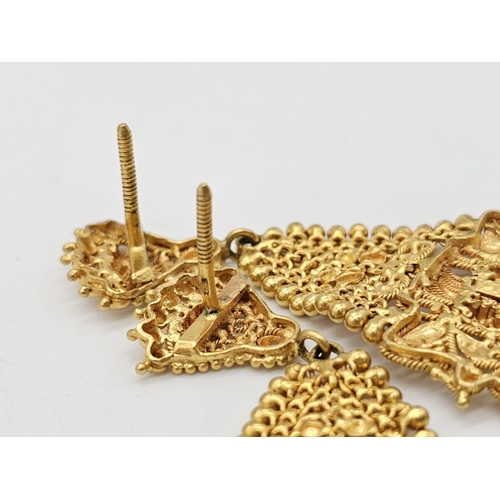 712 - Withdrawn
A yellow gold mixed lot consisting of: 
22 K Necklace and pair of earrings (butterfly miss... 