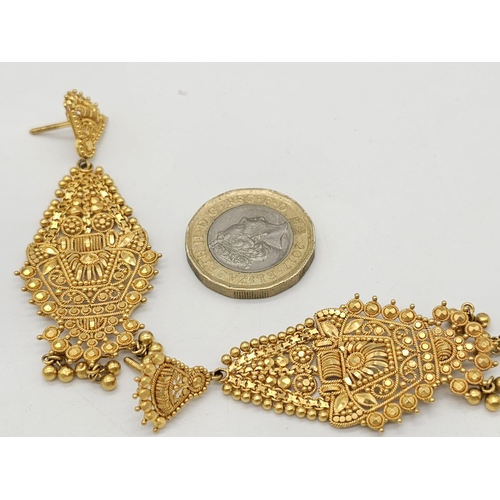 712 - Withdrawn
A yellow gold mixed lot consisting of: 
22 K Necklace and pair of earrings (butterfly miss... 