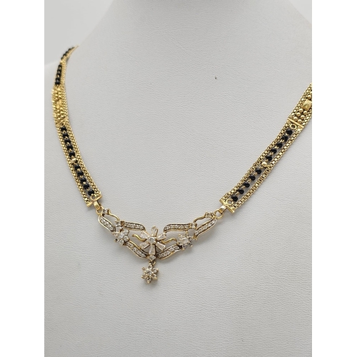 797 - A yellow gold mixed lot consisting of: 
24 K gold bar (weight: 2.5 g)
22 K Chain with pendant
18 K  ... 