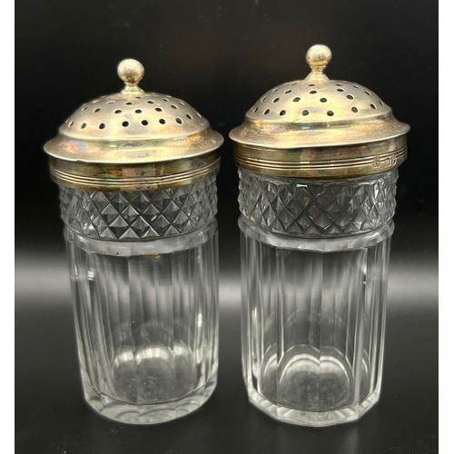 1044 - 2 GEORGIAN HALLMARKED SILVER TOP CUT GLASS SHAKER BOTTLES .  11 ANS 12cms TALL   402gms