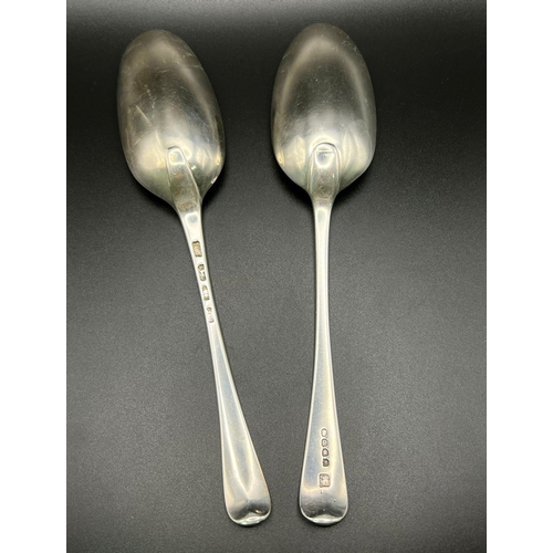 1058 - 2 EARLY GEORGIAN TABLE SPOONS WITH CLEAR HALLMARKS  . 131.2gms