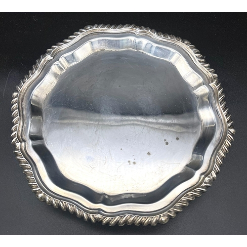 1466 - A SOLID SILVER FOOTED PLATTER HALLMARKED 1975 BIRMINGHAM .  147.2gms