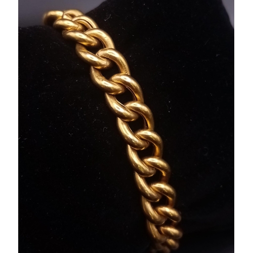 376 - An 18K Yellow Gold Flat Curb Link Bracelet. 18cm. 20.67g.