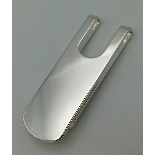 1502 - A 925 Silver Money Clip with a Pair of White Metal Dumbbell Cufflinks.