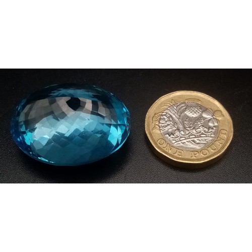 297 - A 99.95ct Swiss Blue Oval, Blue Topaz Gemstone. Comes with GFCO Certificate.