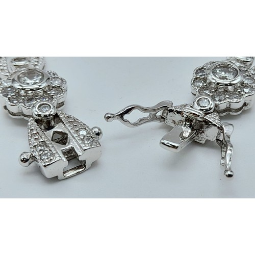 1164 - A VERY PRETTY STONE SET SILVER BRACELET WITH DOUBLE SAFETY CATCHES .   18.6gms   16cms